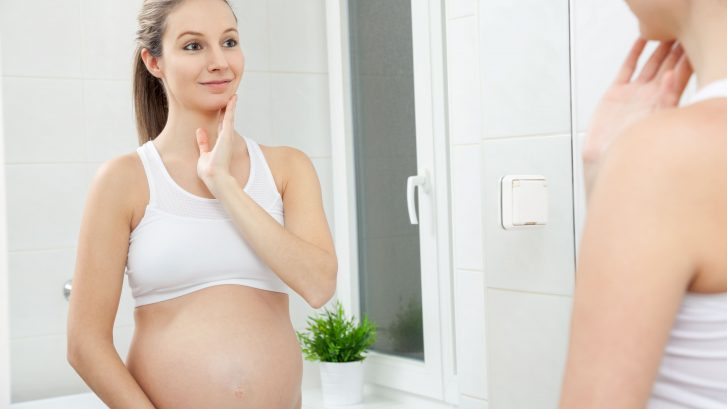 pregnant woman practicing skincare
