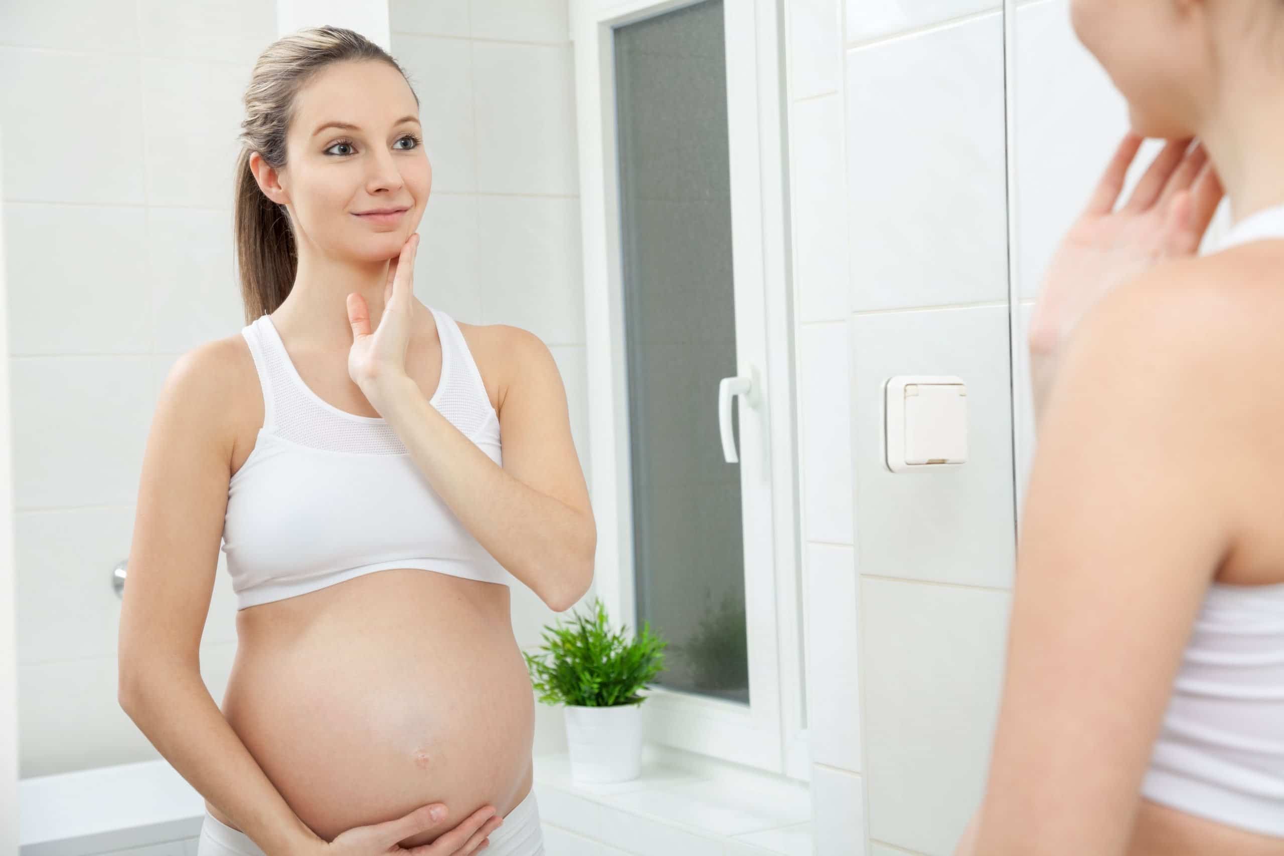 pregnant woman practicing skincare